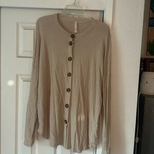 My story tan with brown button sweater.  Size large.